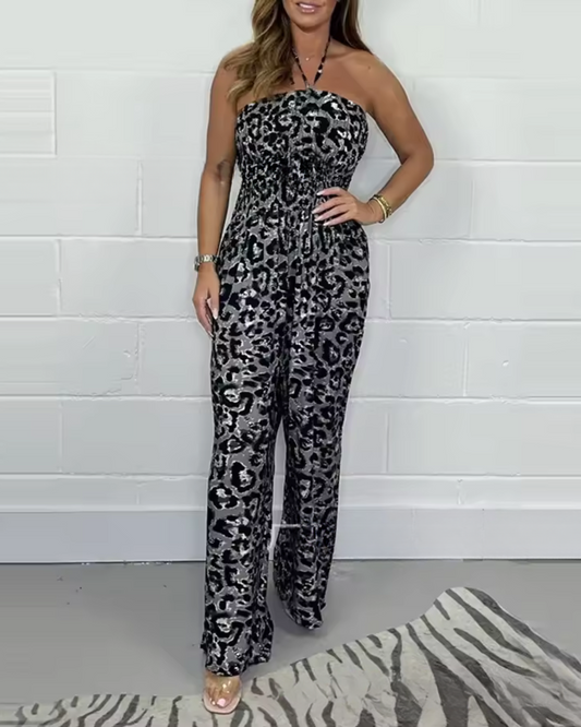 Mono estampado sin tirantes con escote halter y perneras anchas