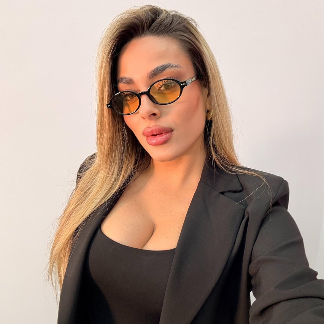 Gafas de Sol Ovaladas con Montura Negra de Estilo Retro Moderno