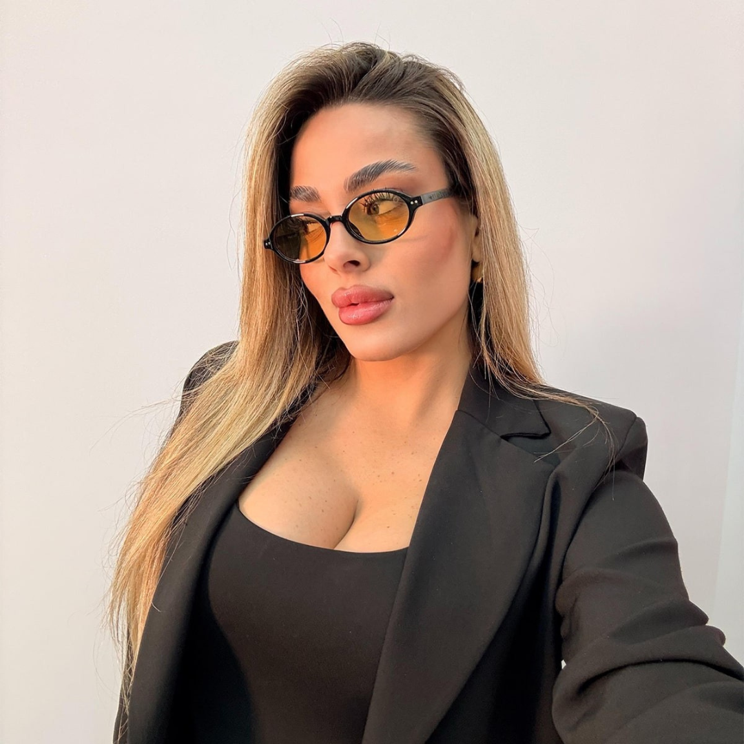 Gafas de Sol Ovaladas con Montura Negra de Estilo Retro Moderno