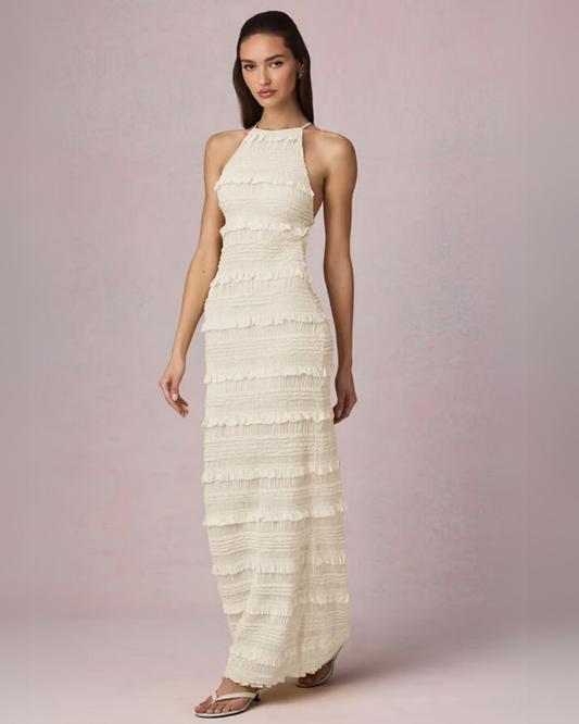 Vestido largo de volantes con cuello halter y espalda descubierta