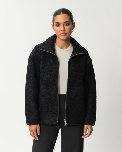 Abrigo de lana con cremallera frontal y cuello alto